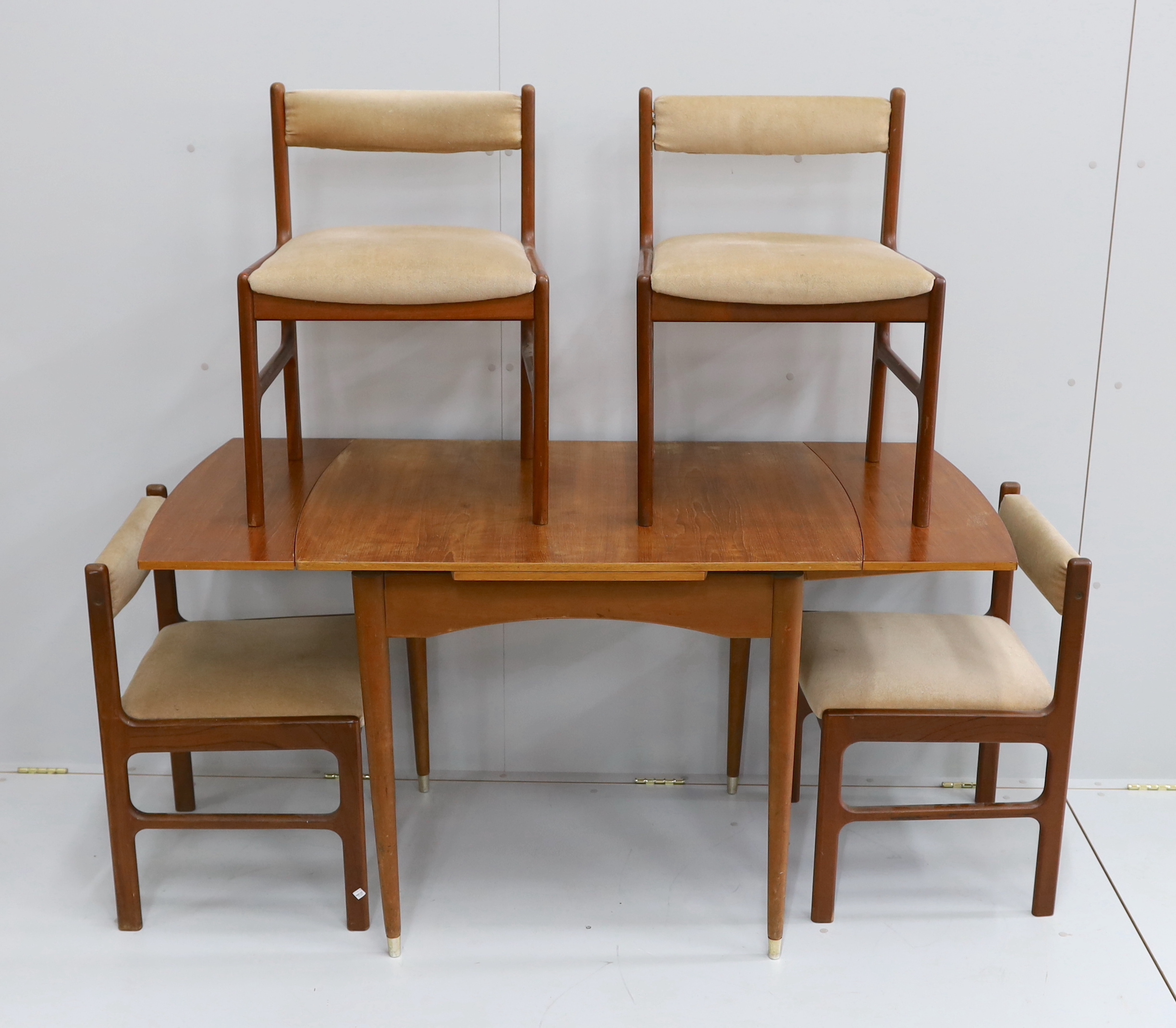 A mid century McInstosh teak draw leaf dining table, 150cm extended, depth 76cm, height 77cm and four chairs